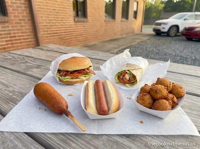 Cheap Cook Out menu items: a hot dog, corn dog, hushpuppies, BLT and chicken wrap
