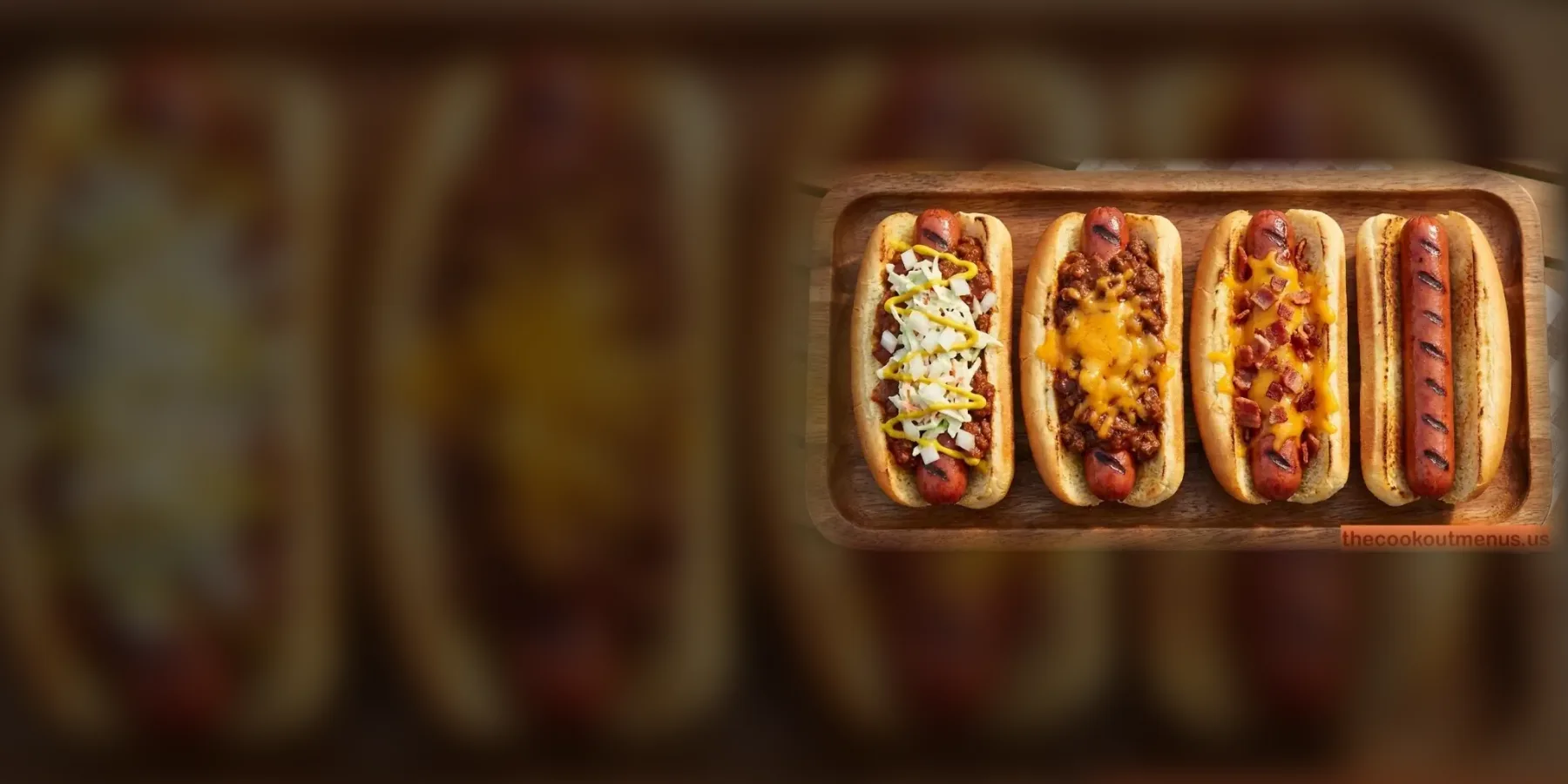 Four Cookout hot dogs on a wooden board: Cook Out Style with chili, slaw, mustard and onion, a chili cheese dog, a bacon cheddar dog and a plain grilled hot dog